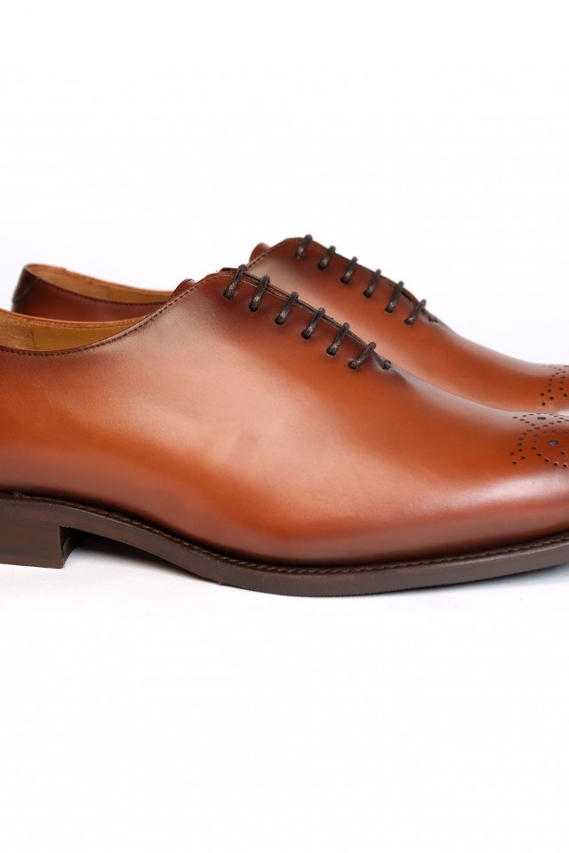 Med-brown whole cut shoes
